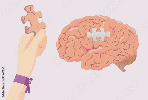 Hand with a purple ribbon holding the jigsaw of brain for add it on space of the puzzle. Concept illustration about Alzheimer and Dementia Awareness week.