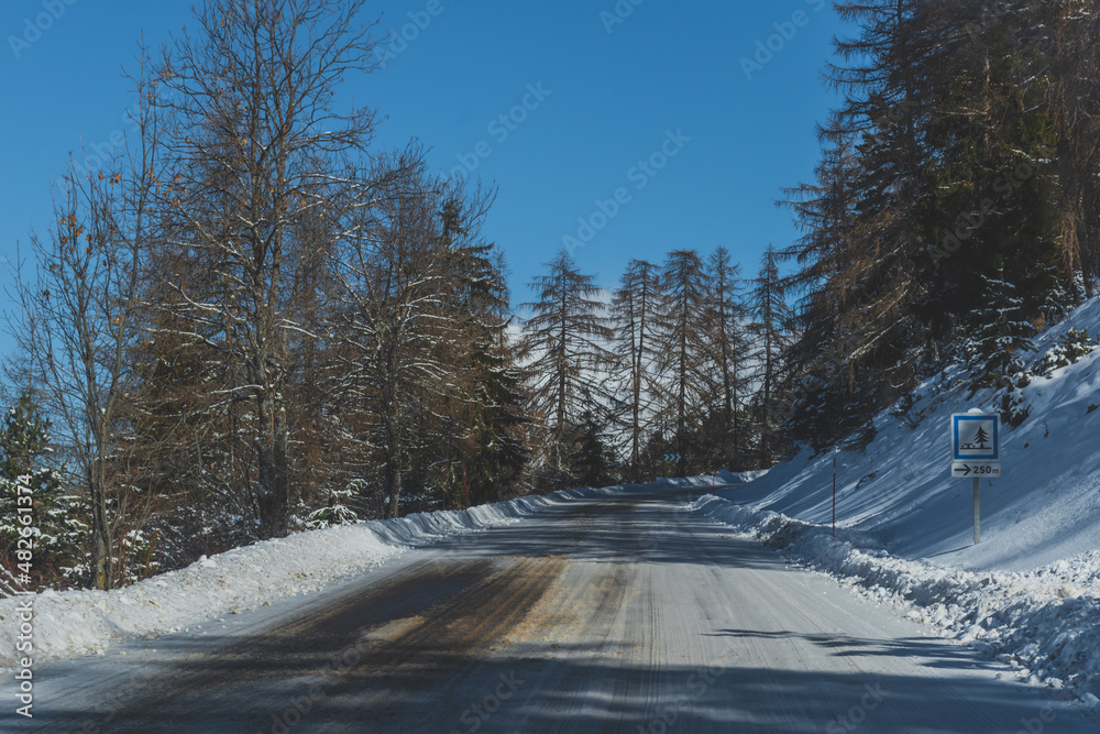 A picturesque landscape view of the road in the snowcapped French Alps mountains on a sunny winter day (the Devoluy valley) A picturesque landscape view of the road in the snowcapped French Alps mountains on a sunny winter day (the Devoluy valley)