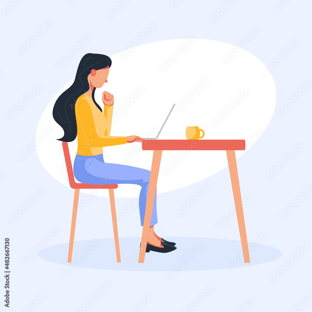 woman with notebook sitting at a table working on a project woman with notebook sitting at a table working on a project