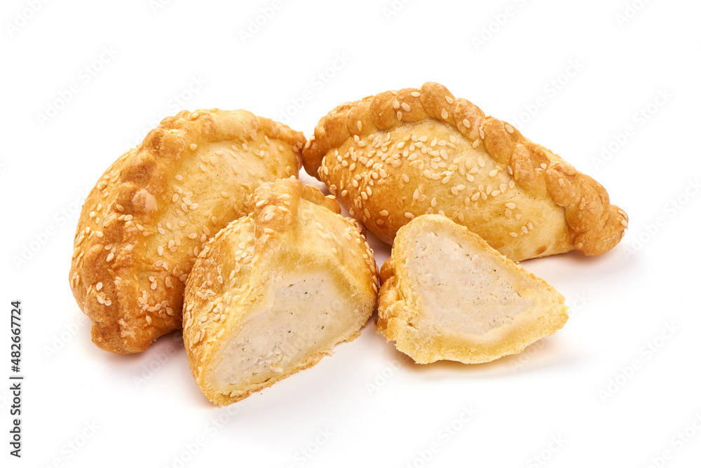 Freshly baked patties, isolated on white background.