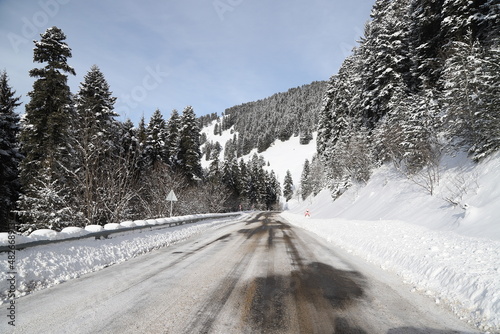 Curved asphalt road in a forest covered with snow in.turkey