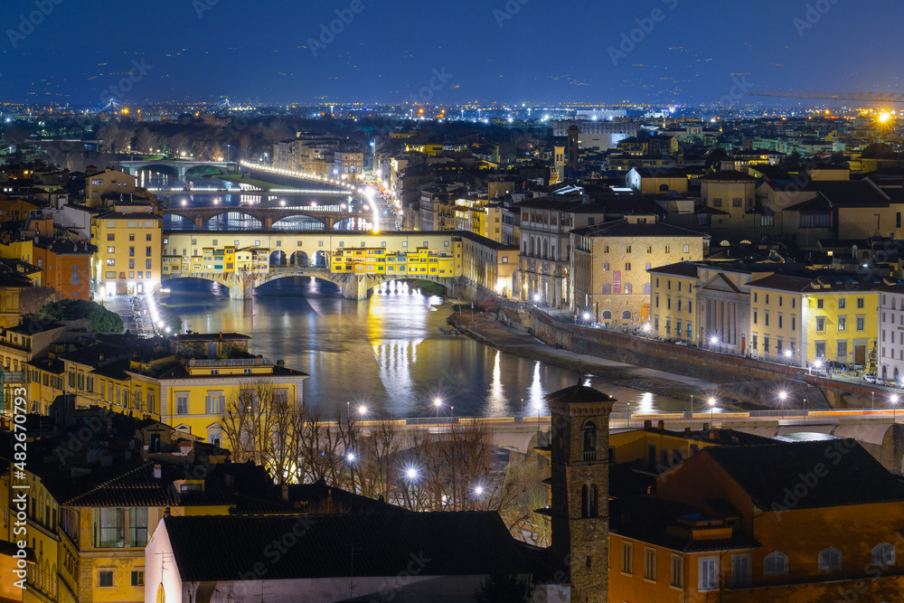 Ponte Vecchio bridge, river Arno promenade and other florentians bridges. Night shot. Medieval famous places in Florence, Tuscany - 12 Jan 2022