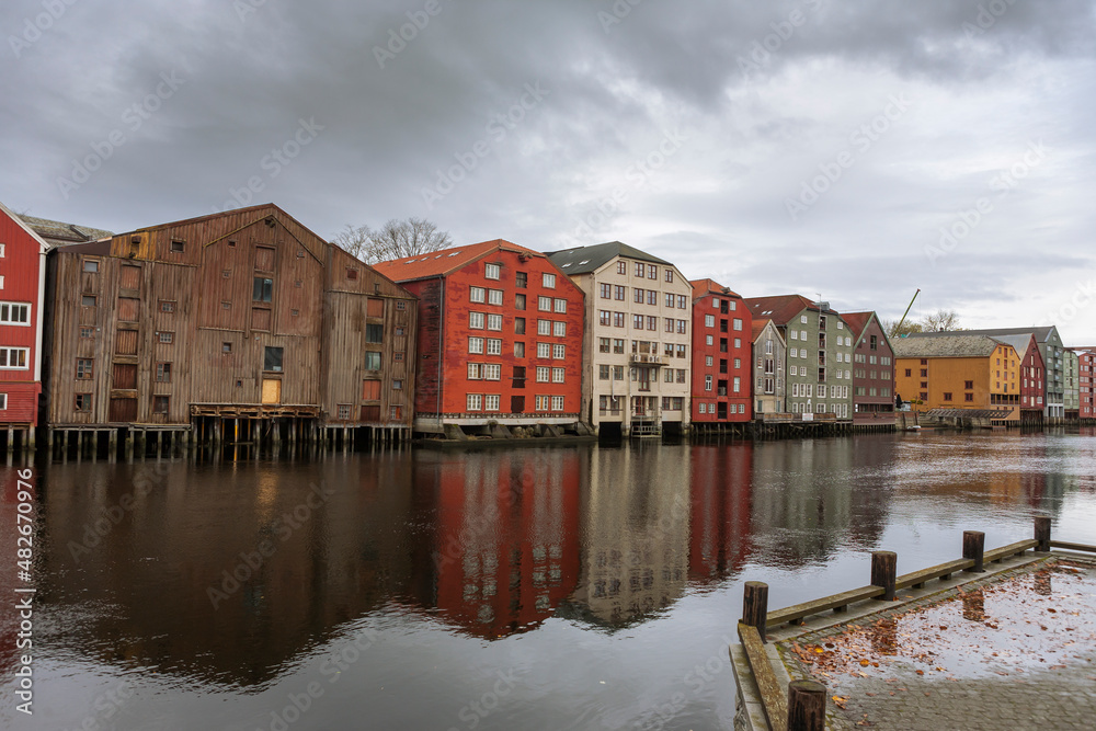 Old warehouses line the Nidelva riverbank, Trondheim, Trøndelag, Norway