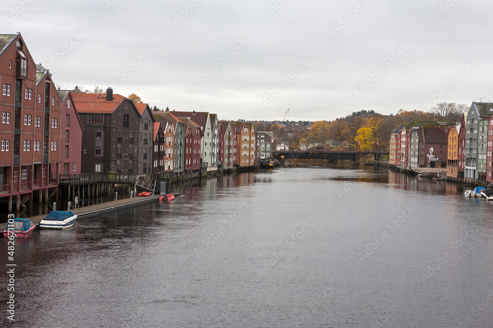 The view from Bakke Bridge: old warehouses line each side of the Nidelva river, Trondheim, Trøndelag, Norway
