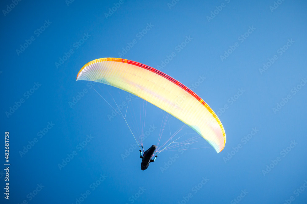 paragliding flight in the mountains. Le Grand-Bornand, France paragliding flight in the mountains. Le Grand-Bornand, France
