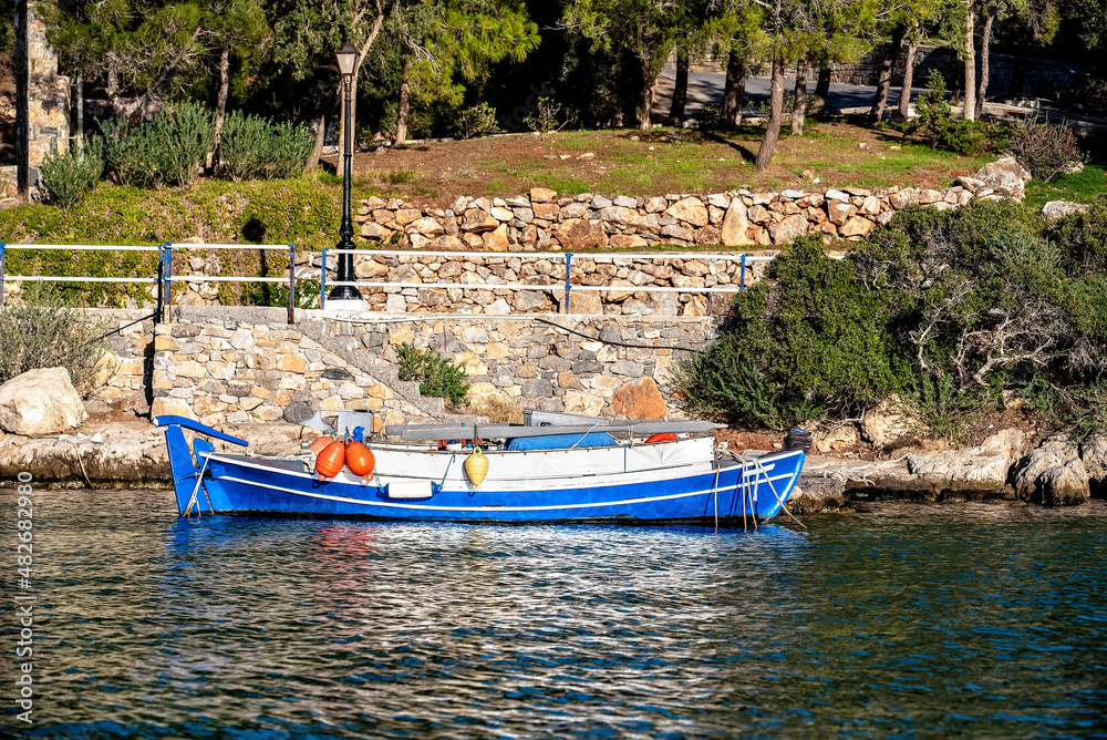 Old traditional wooden fishing boat by the sea, Greek islands, Greece Old traditional wooden fishing boat by the sea, Greek islands, Greece