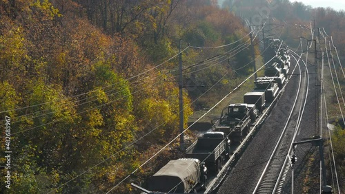 transportation of military equipment by rail.Vehicles and weapons. railway along the forest and mountains