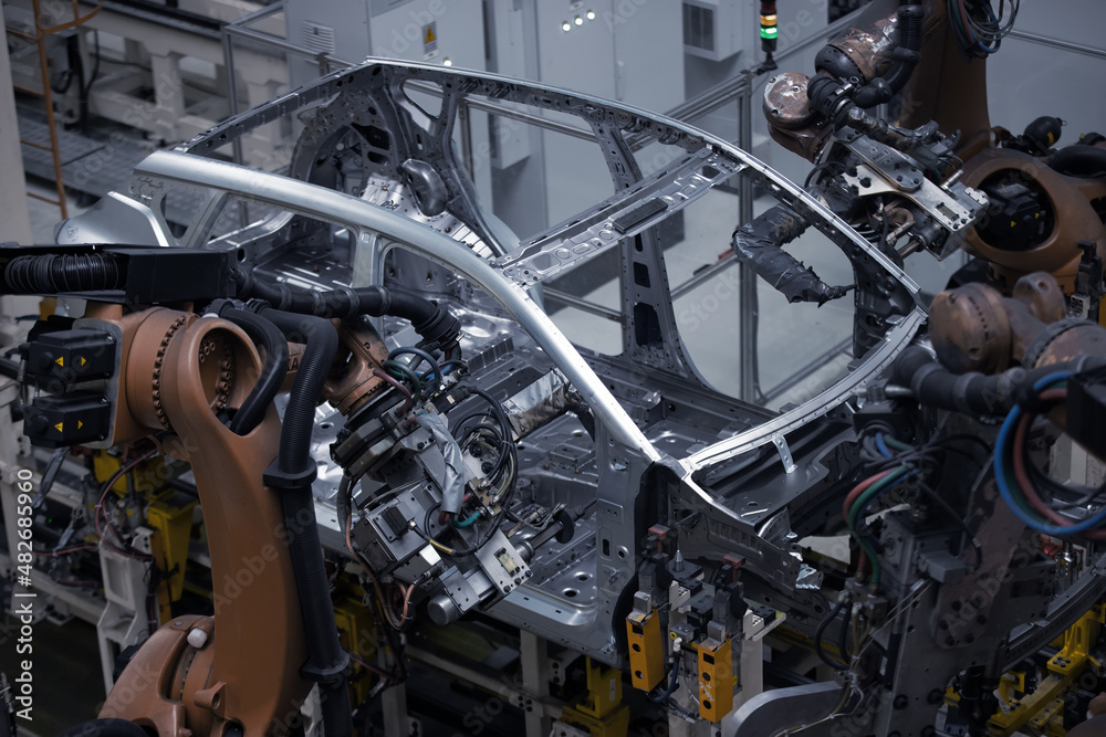 Obraz premium Factory, car manufacturing, innovative robotic welding line