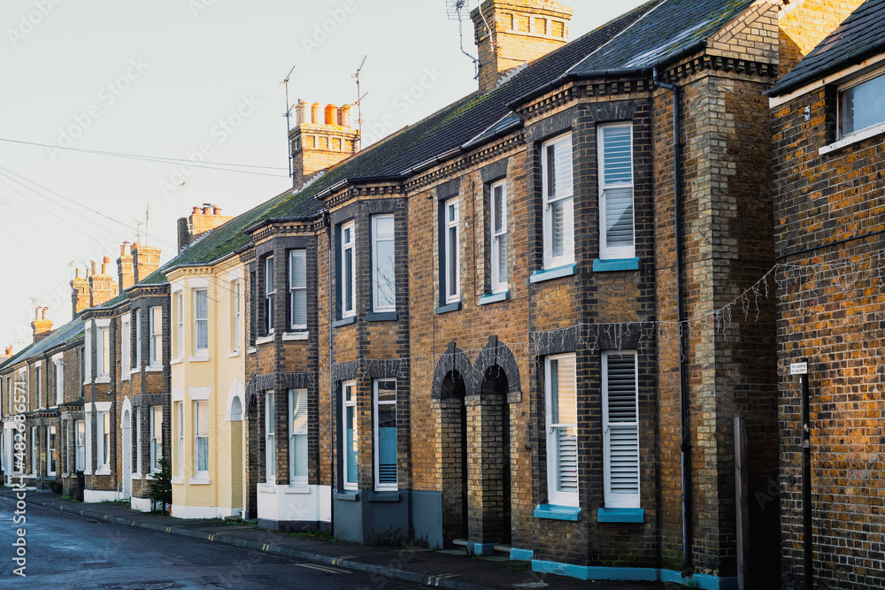 A row of red brick terrace houses in Kent, UK.