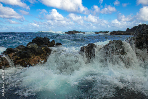 Waves hitting the rocks. Rocky cliffs on sea, seascape. © Volodymyr