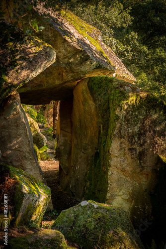 Path inside granite rocks full with moss on a natural landscape