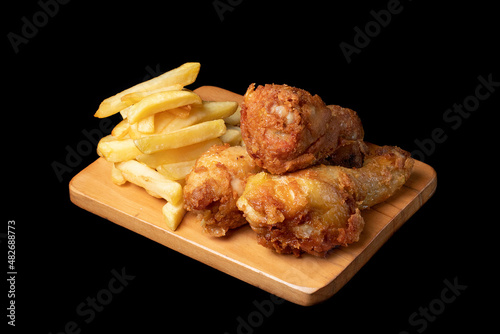 Obraz na płótnie Pollo frito con papas fritas