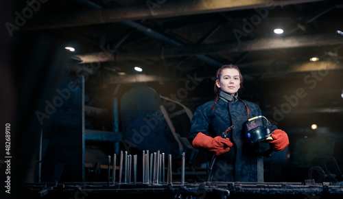 Banner Portrait beautiful woman welder background industry factory workplace