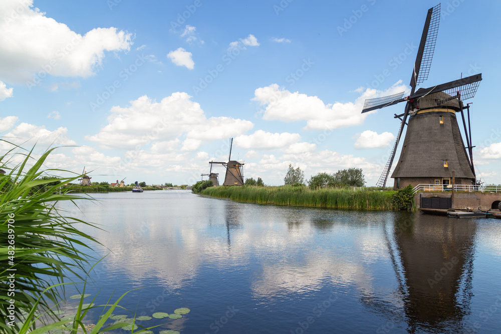 Netherlands rural landscape with windmills at famous tourist site Kinderdijk in the Netherlands.