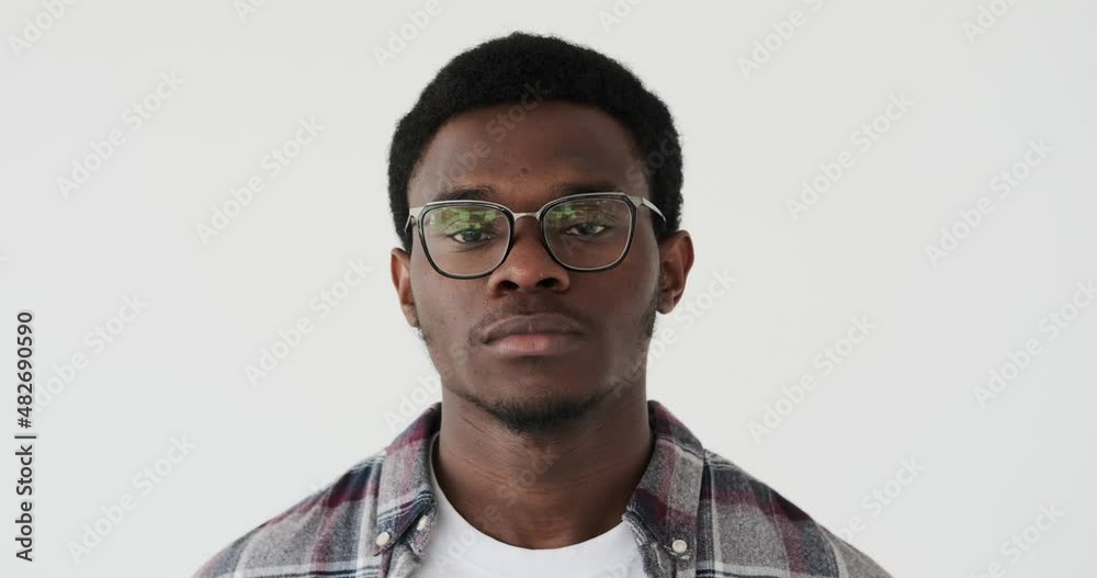 Face of serious man in glasses over white background Face of serious man in glasses over white background
