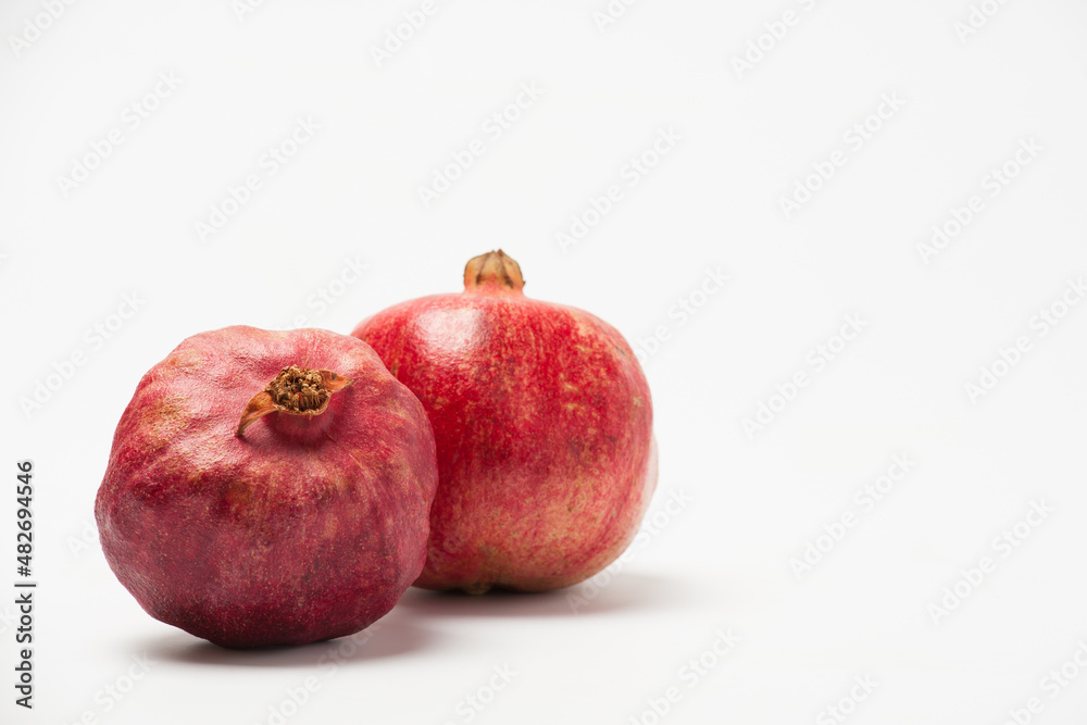 Pomegranate fruit isolated on a white background. Pomegranate fruit isolated on a white background.