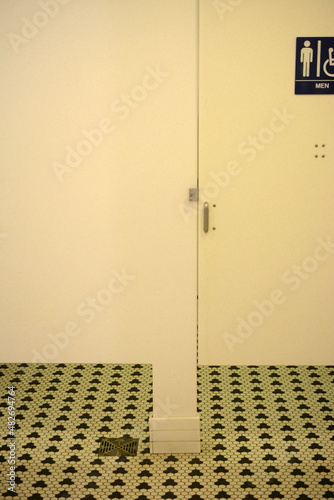 Public bathroom tile and stall