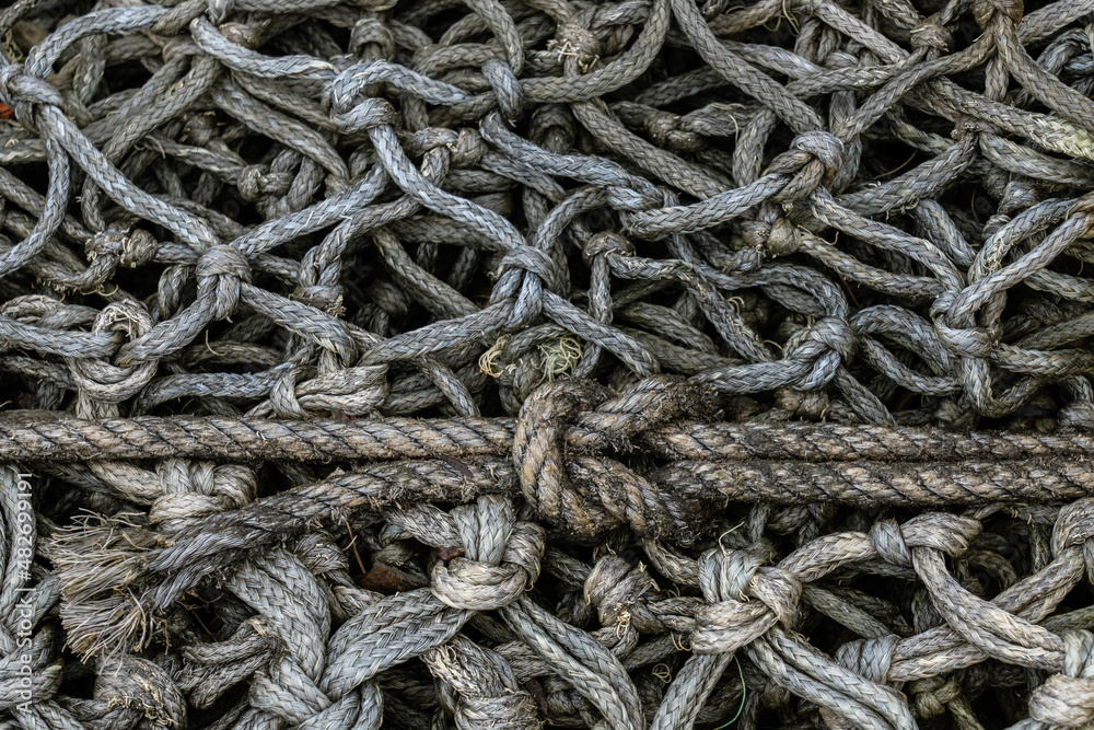 Knotted Rope backdround, wallpaper of rope and fishing nets on an old boat Ilse of Skye
