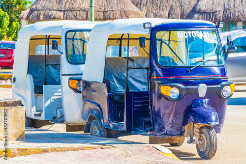 Blue white auto rickshaw tuk tuk Puerto de Chiquilá Mexico. photo