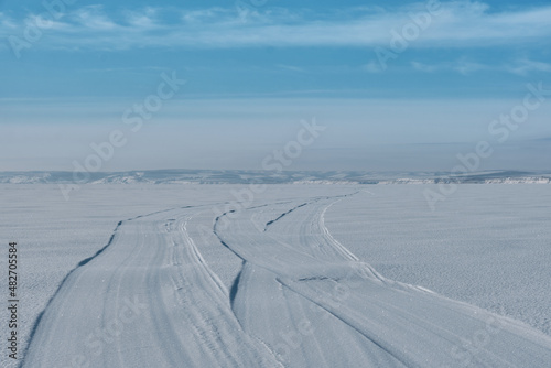 The way on the frozen, snow-covered river to the distant hills © Daniel V7