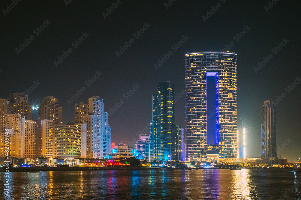 Naklejka premium Dubai Marina Port, UAE, United Arab Emirates - Night view of high-rise buildings of residential district in Dubai Marina.