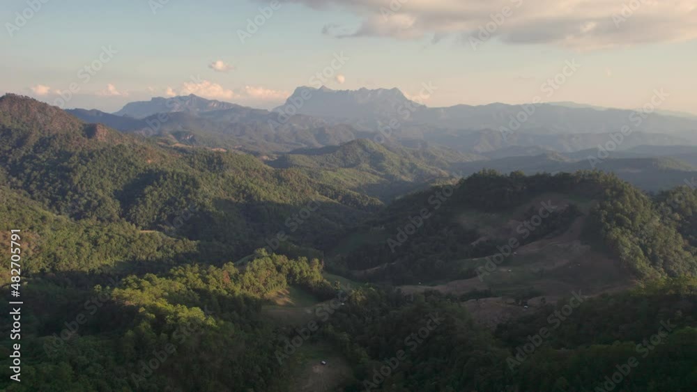 Aerial drone view flying explore with Doi Luang Chiang Dao mountain and tropical rainforest in national park at evening Aerial drone view flying explore with Doi Luang Chiang Dao mountain and tropical rainforest in national park at evening
