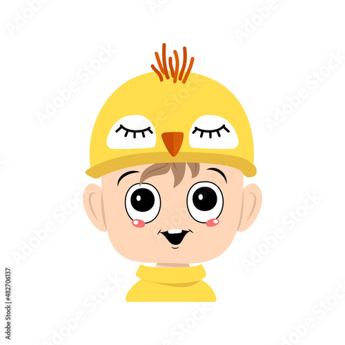Avatar of boy with big eyes and wide happy smile in cute yellow chicken hat. Head of child with joyful face for holiday Easter, New Year or costume for party. Vector flat illustration