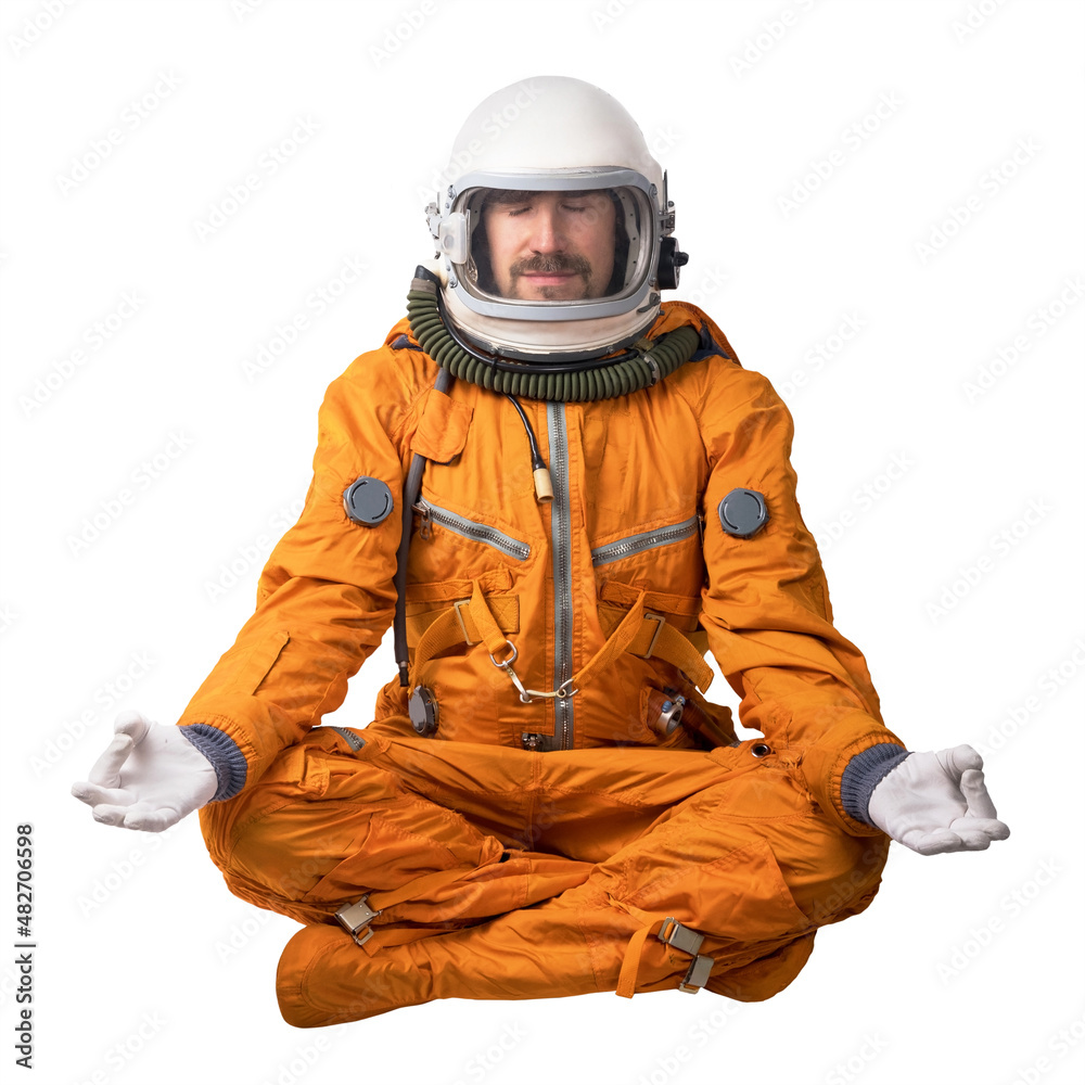 Astronaut wearing orange space suit and space helmet sitting in a lotus  pose meditating isolated on a white background. Meditation concept Stock  Photo | Adobe Stock