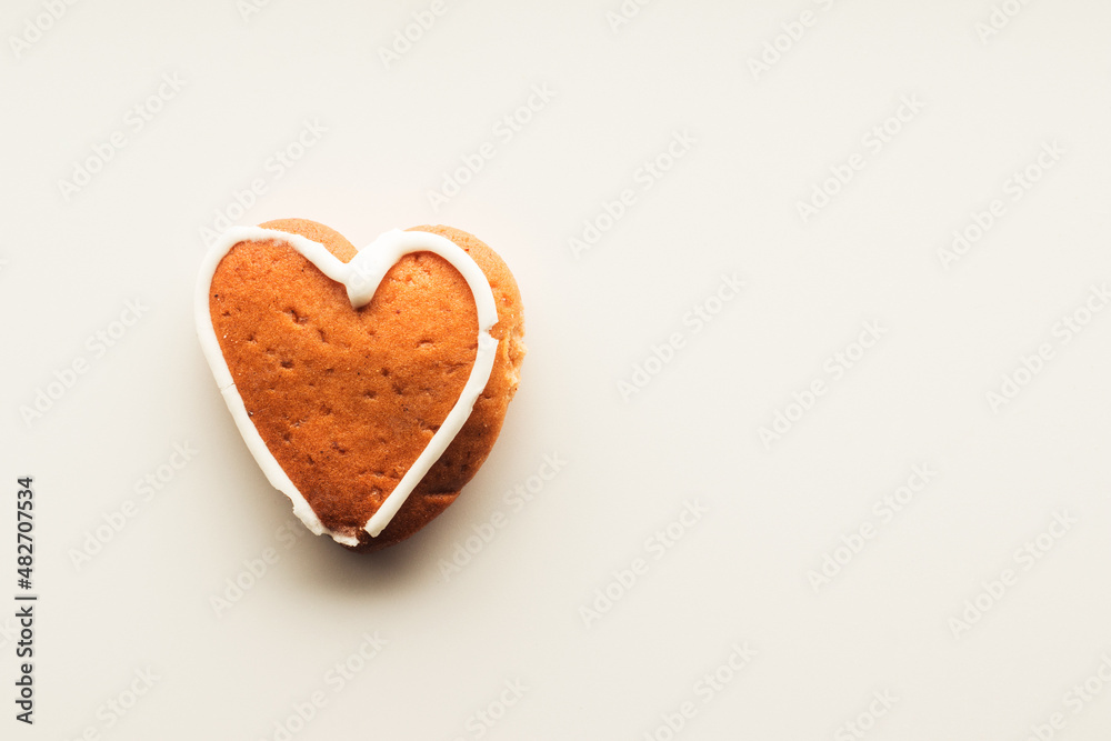 Gingerbread in the shape of a heart with a pattern of sugar glaze