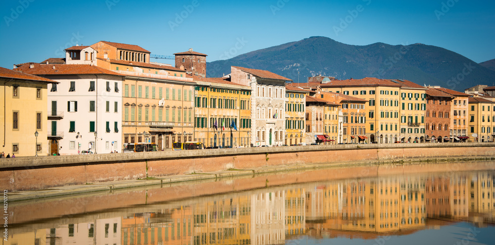 A row of historic buildings along the river Arno in Pisa, Italy, October 2016