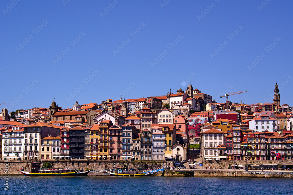 View of the Douro River as it passes through Porto and the buildings by the shore