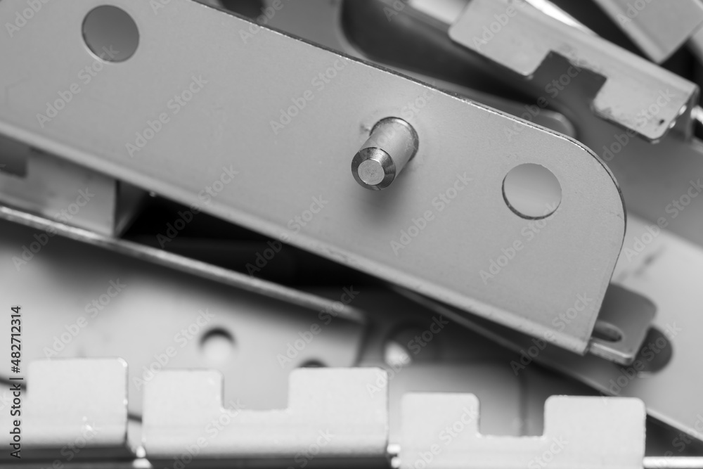 Close up shot of galvanized metal brackets with metal pin Close up shot of galvanized metal brackets with metal pin