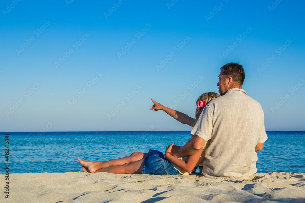 happy loving couple by the sea in the nature
