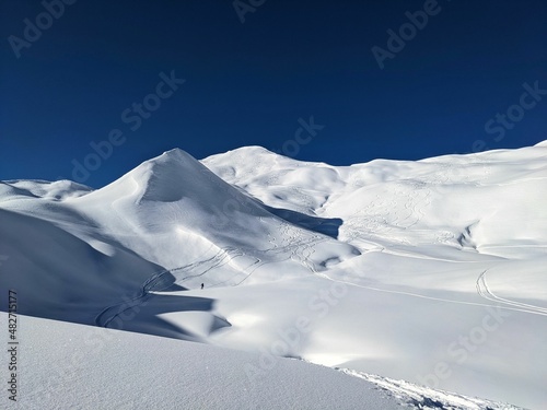 Ski mountaineering on the Girenspitz and Schafberg in St. Antonien above Partnun, Graubunden. Ski tour in deep snow photo