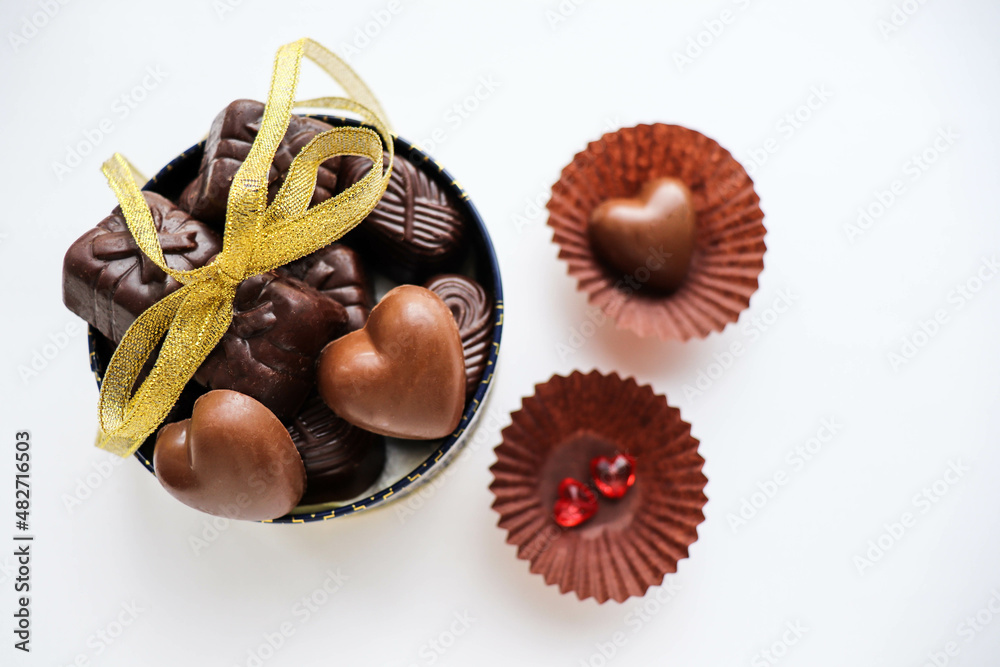 sweet gift for valentine's day. small gift box, red heart and chocolates sweet gift for valentine's day. small gift box, red heart and chocolates