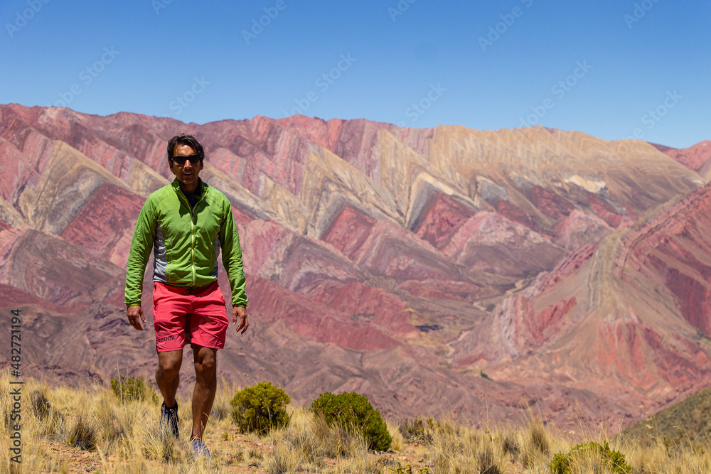 Man walking in the mountains of El Hornocal, Jujuy, Argentina