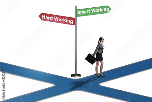 Businesswoman at the crossroads on working smart or hard