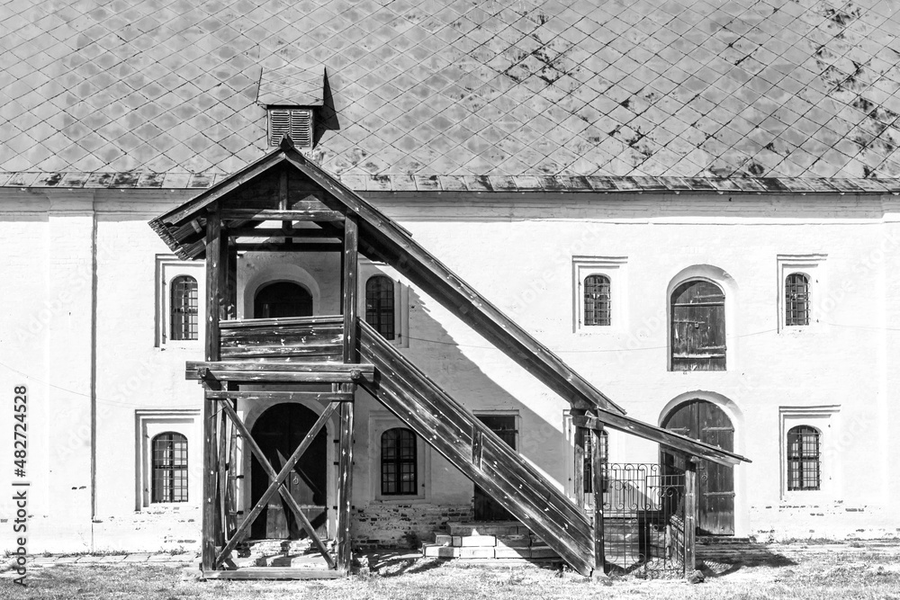 Facade of one of the old buildings of the Ryazan Kremlin with wooden stairs and wooden doors