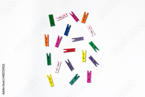 Background, colored clothespins, chaotically scattered clothespins