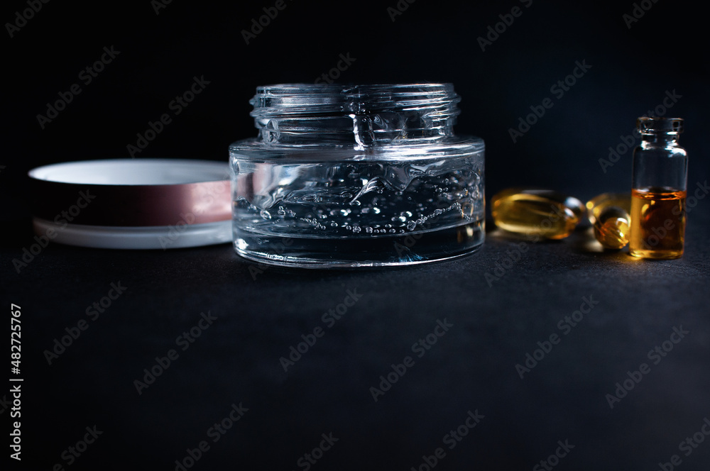 Transparent jar with cosmetic moisturizing gel with hyaluronic acid with bubbles and vitamins