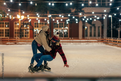 Couple in winter ice skating