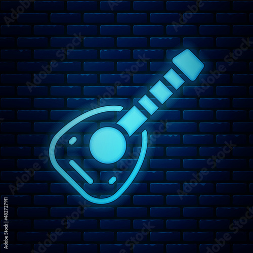 Glowing neon Musical instrument lute icon isolated on brick wall background. Arabic, Oriental, Greek music instrument. Vector