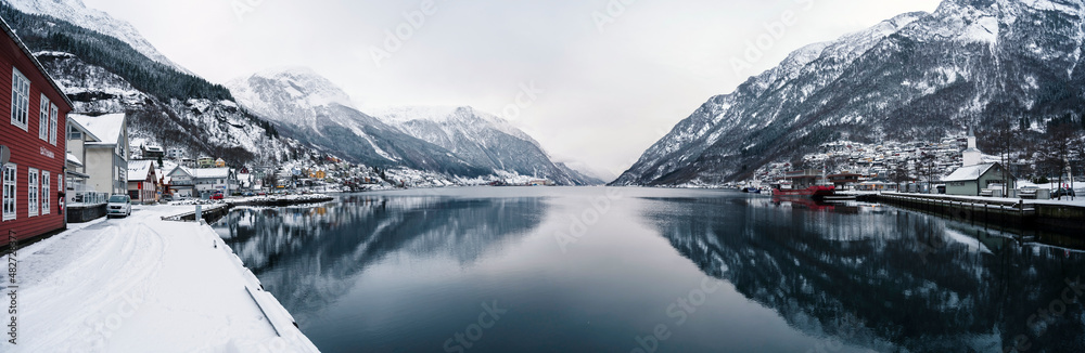 Odda, Norway - January 08 2022: City Odda and Hardangerfjord in Norway during winter with snow