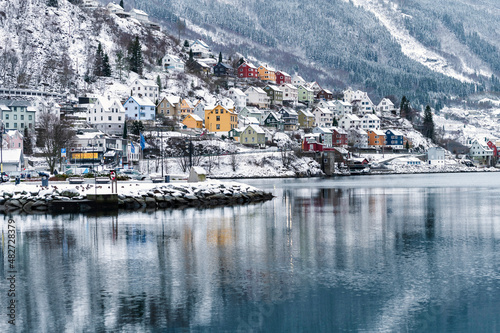 Odda, Norway - January 08 2022: City Odda and Hardangerfjord in Norway during winter with snow © valdisskudre