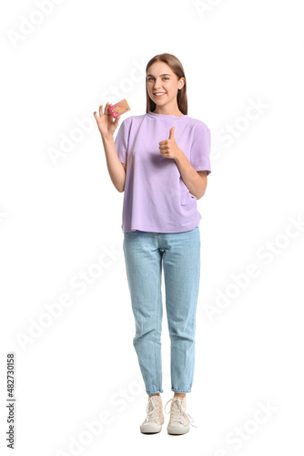 Happy young woman holding g...