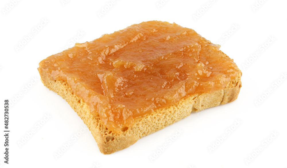 Homemade apricot jam on a toast isolated on white background