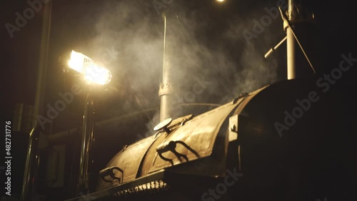 Hot BBQ Charcoal Grill Splashing Fire at Night