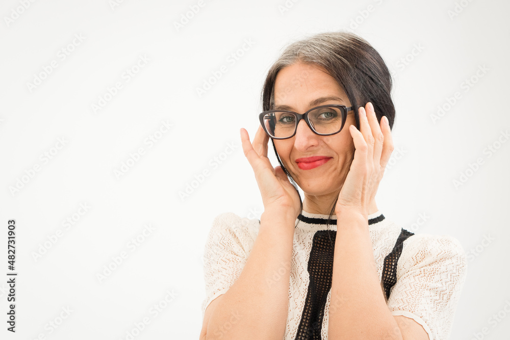 Studio photo of middle aged woman starting getting grey-haired wearing black and white clothes on white background, middle age sexy lady, happy life concept Studio photo of middle aged woman starting getting grey-haired wearing black and white clothes on white background, middle age sexy lady, happy life concept