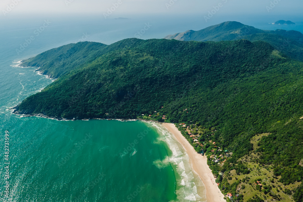 Coastline with beach, mountains and ocean with waves in Brazil, Matadeiro Beach. Aerial view