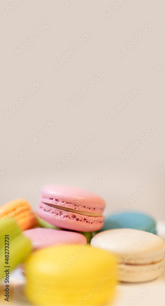 colorful macaroons on wooden background colorful macaroons on wooden background